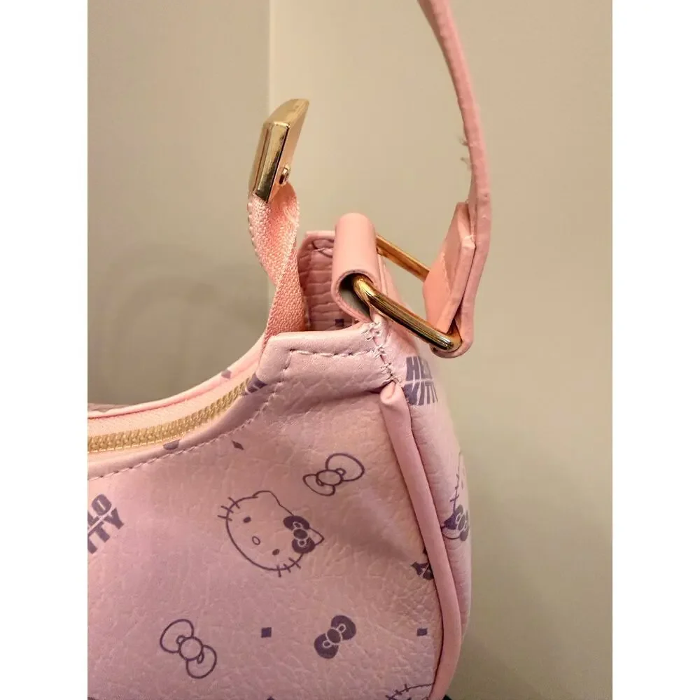 Hello Kitty Pink monogram crescent shoulder bag, all-over character print.